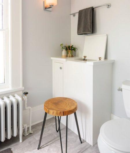 laundry chute opened with small stool
