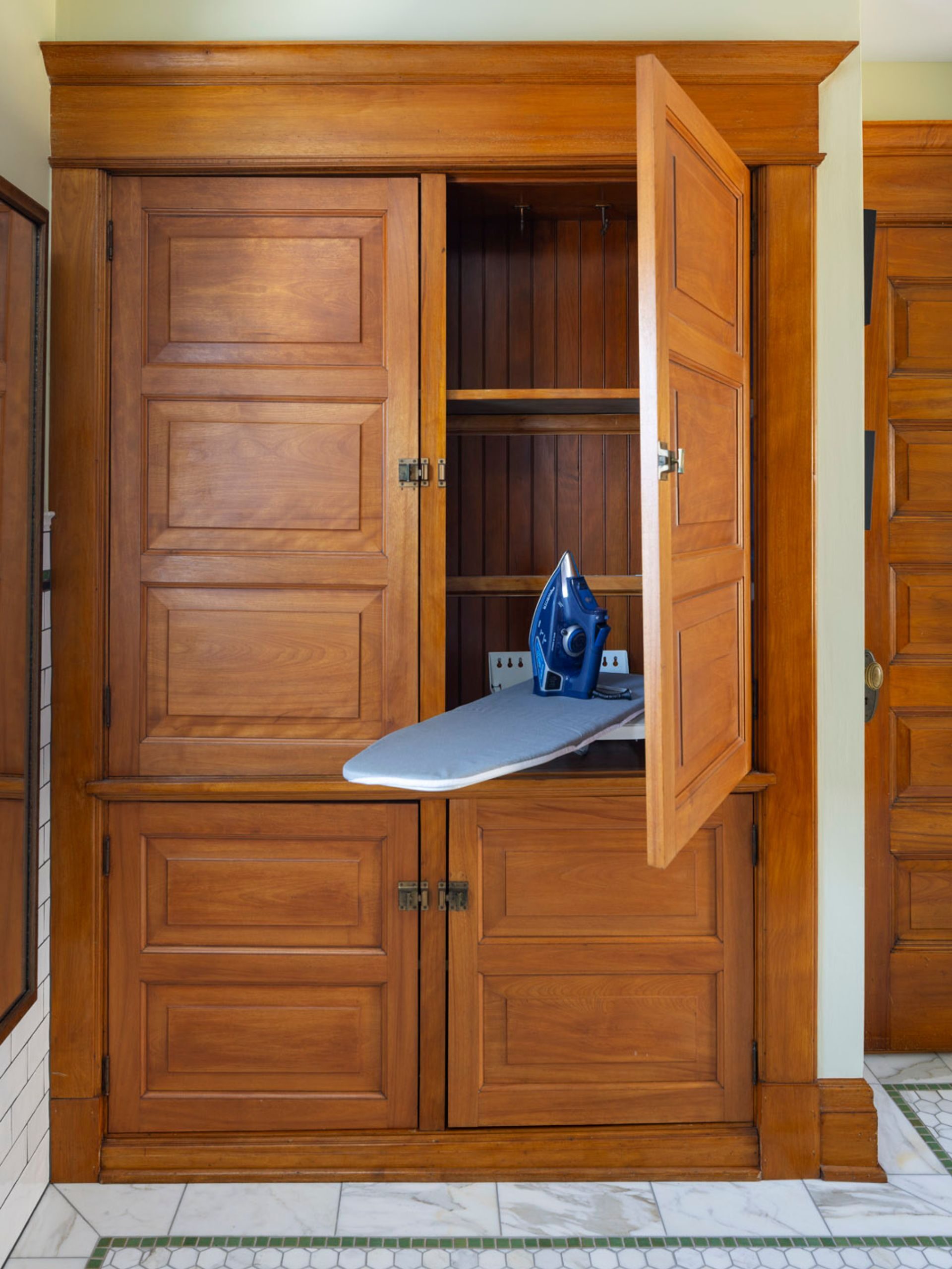 built in cabinetry with ironing board