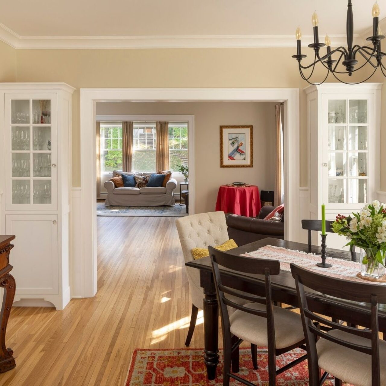 bungalow dining and family room, cast iron chandelier, hutches
