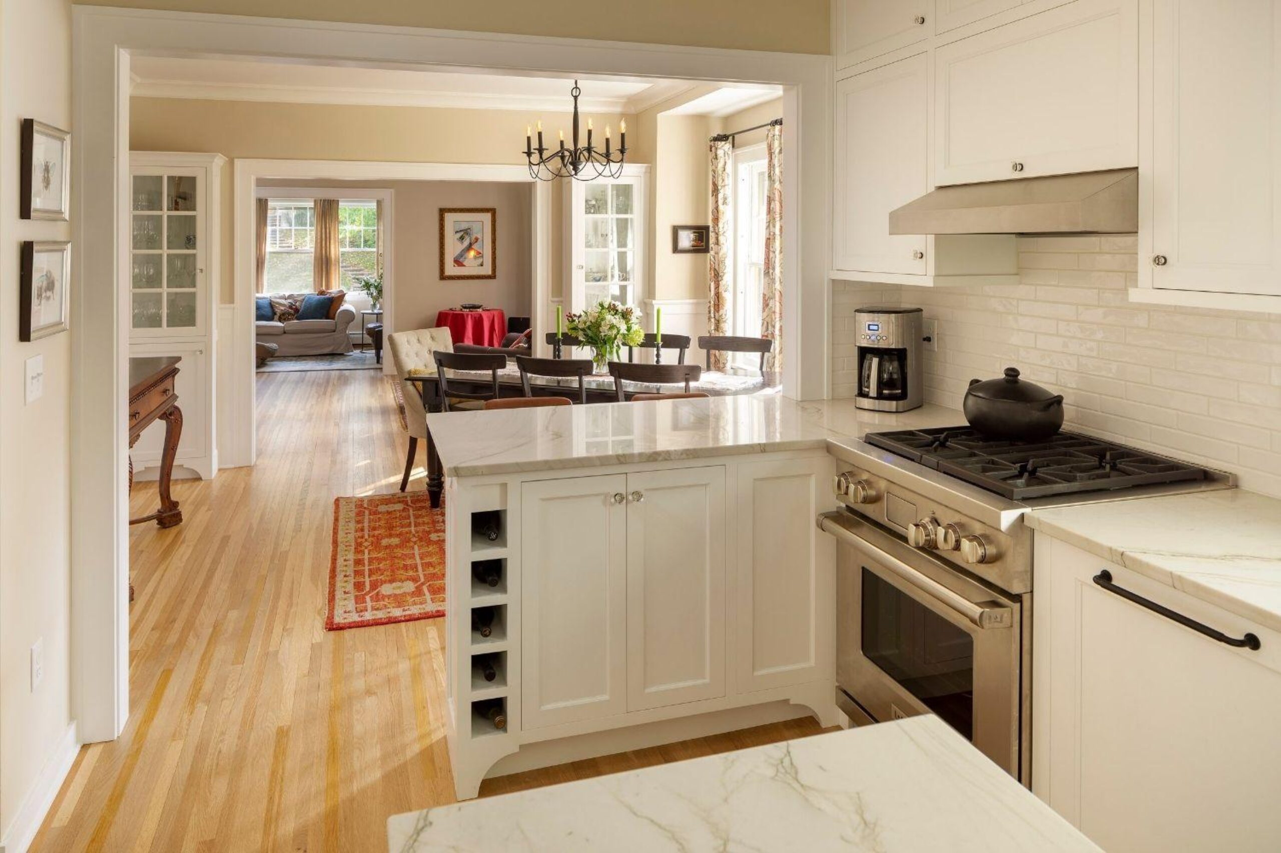 bungalow remodeled kitchen and living room, peninsula cabinet with a bar top,