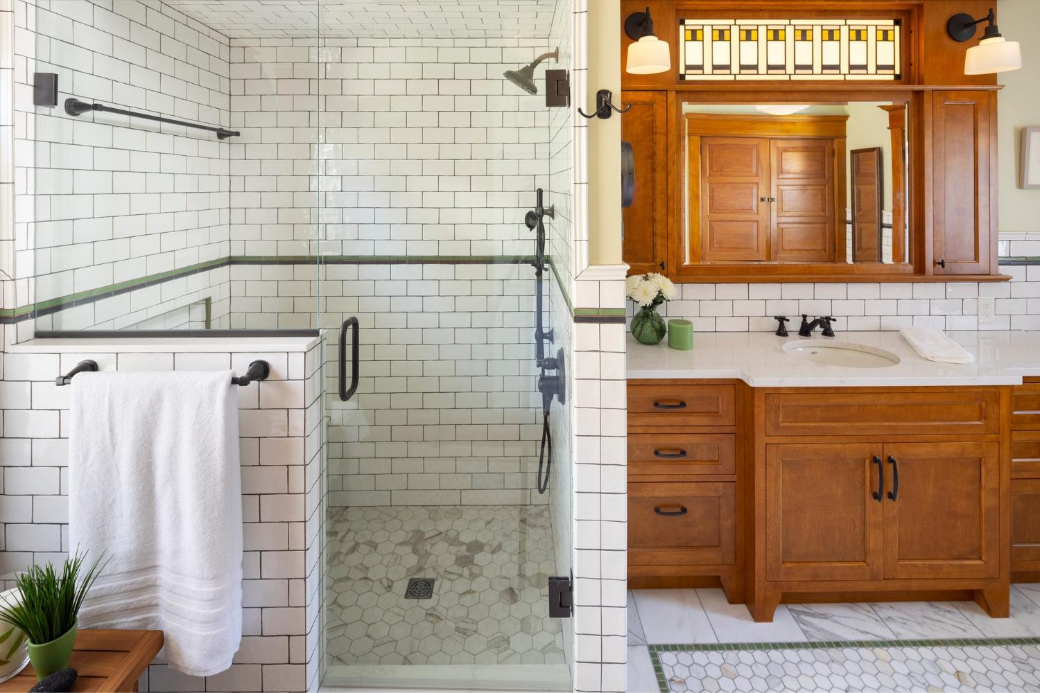 walk-in shower and wood bathroom vanity