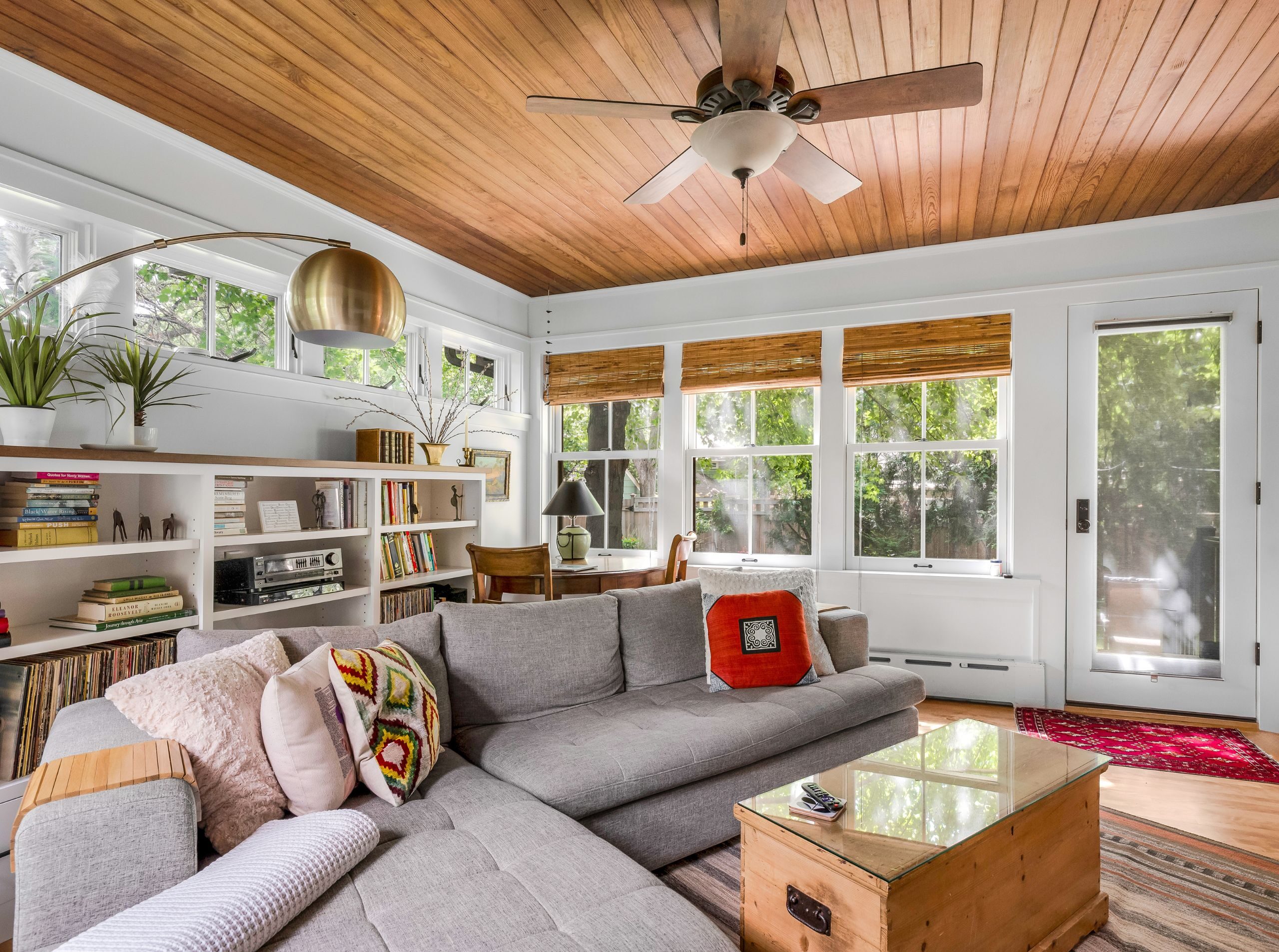Restored Craftsman-style porch with beadboard ceiling, Interior of the sunroom in St. Anthony Park