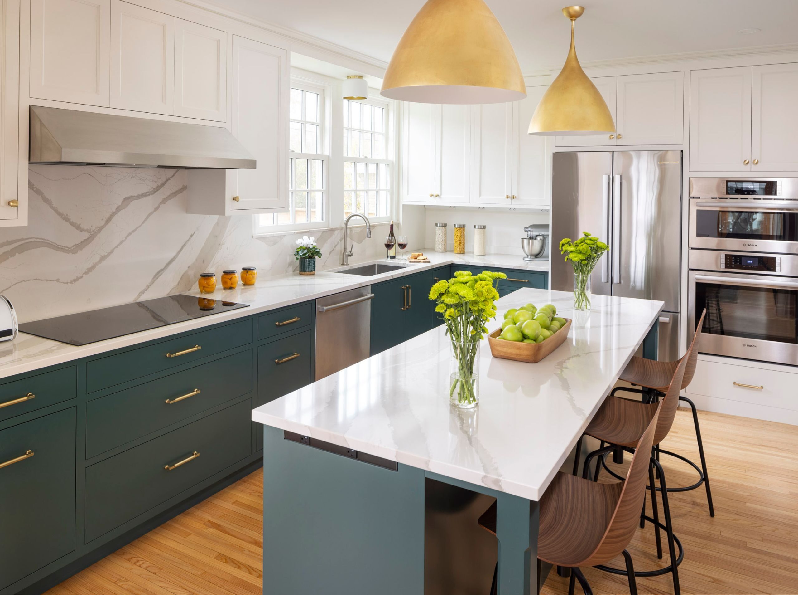 Modern kitchen with white cabinets and blue lower cabinets and island for contrast in Highland Park, MN