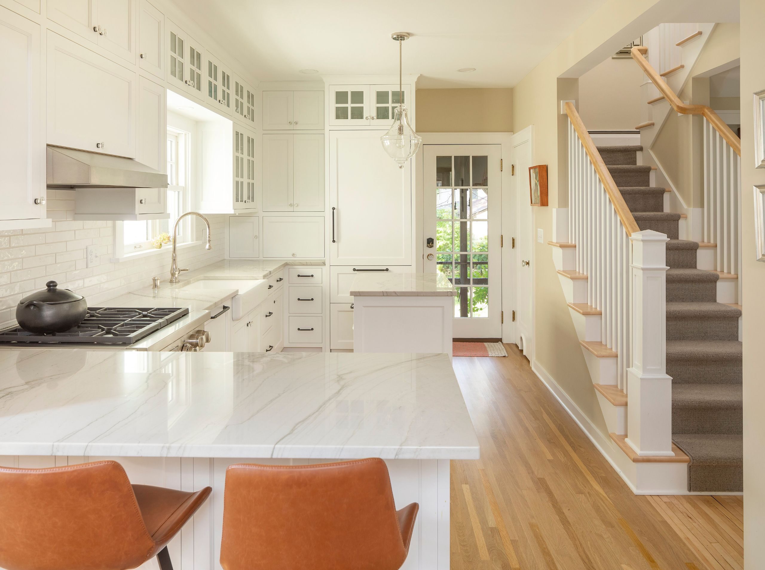 white kitchen in a bungalow home, paneled appliances