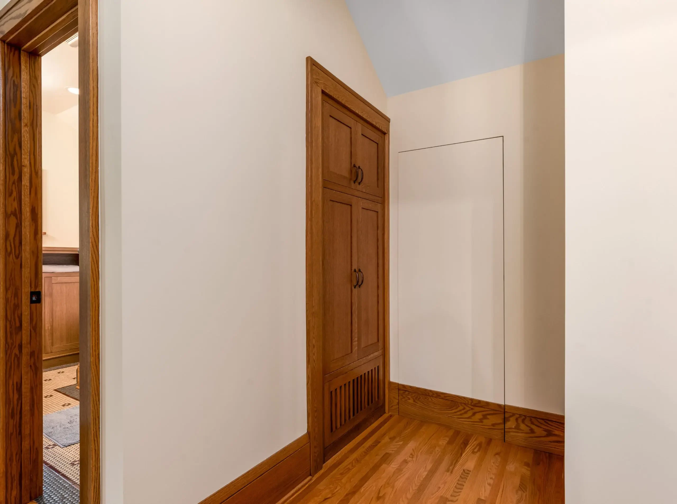 unfinished attic with door closed in a craftsman bungalow in st.paul