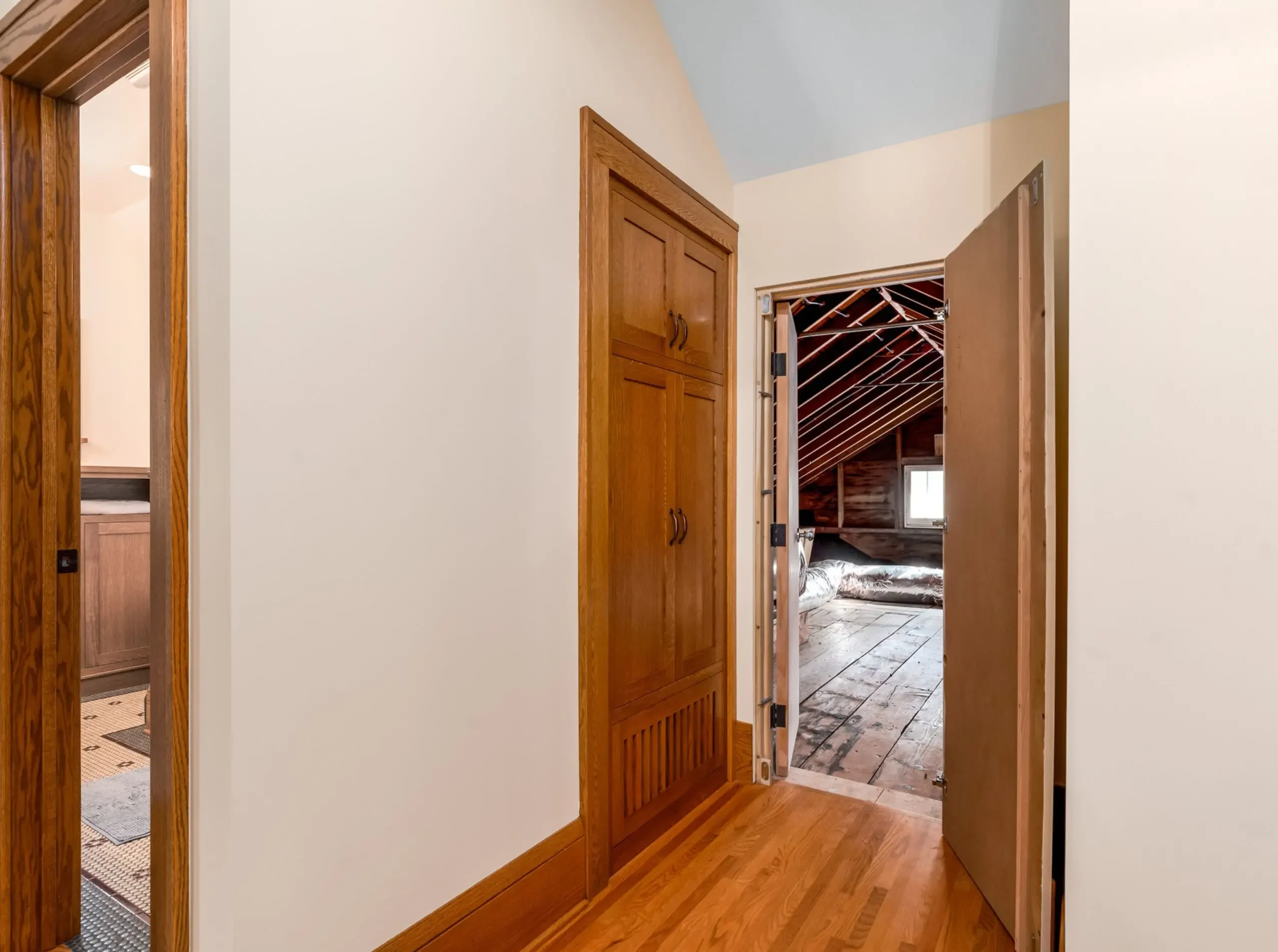 unfinished attic with door open in a craftsman bungalow in st.paul