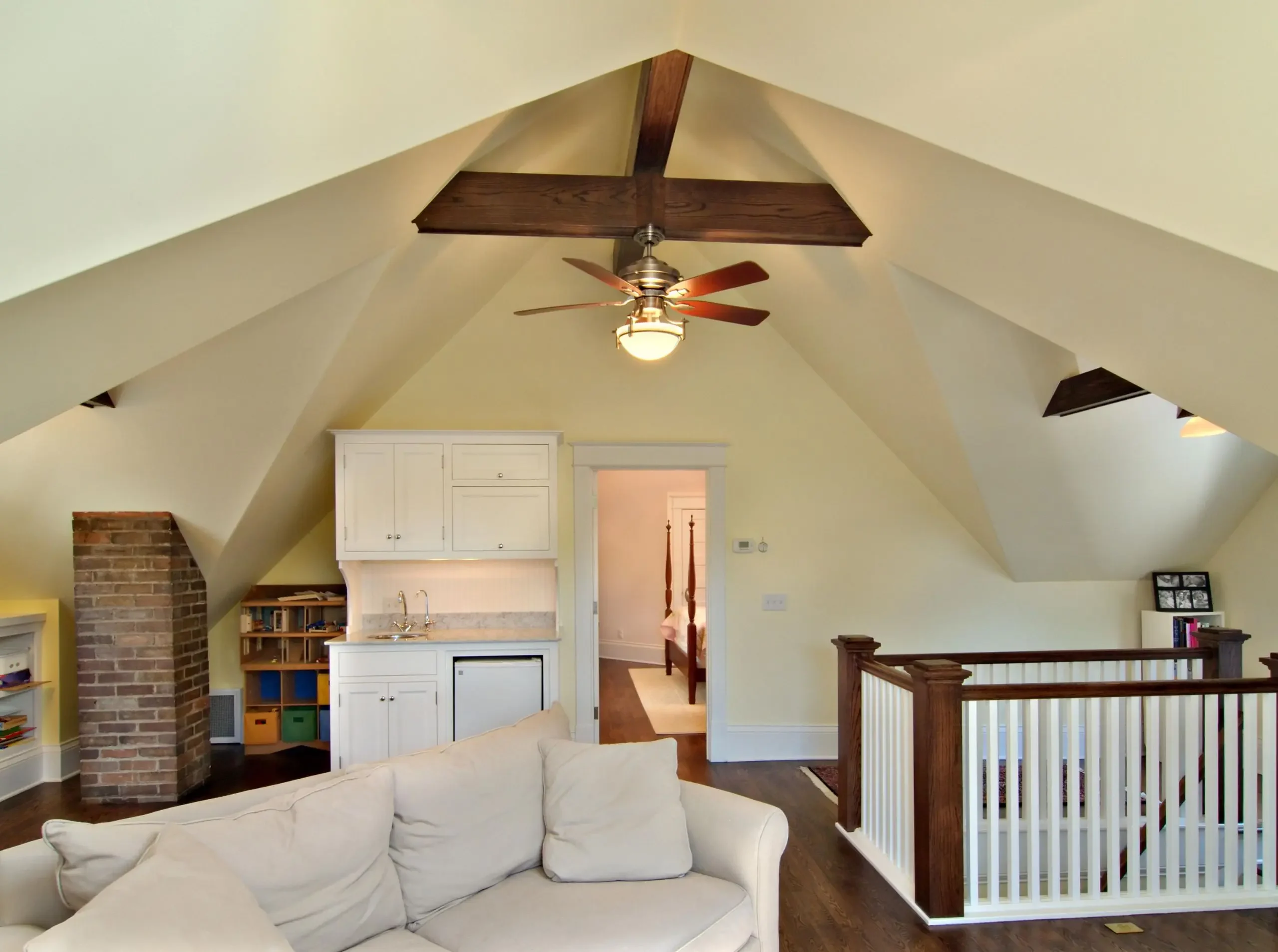 family room in attic looking into bedroom