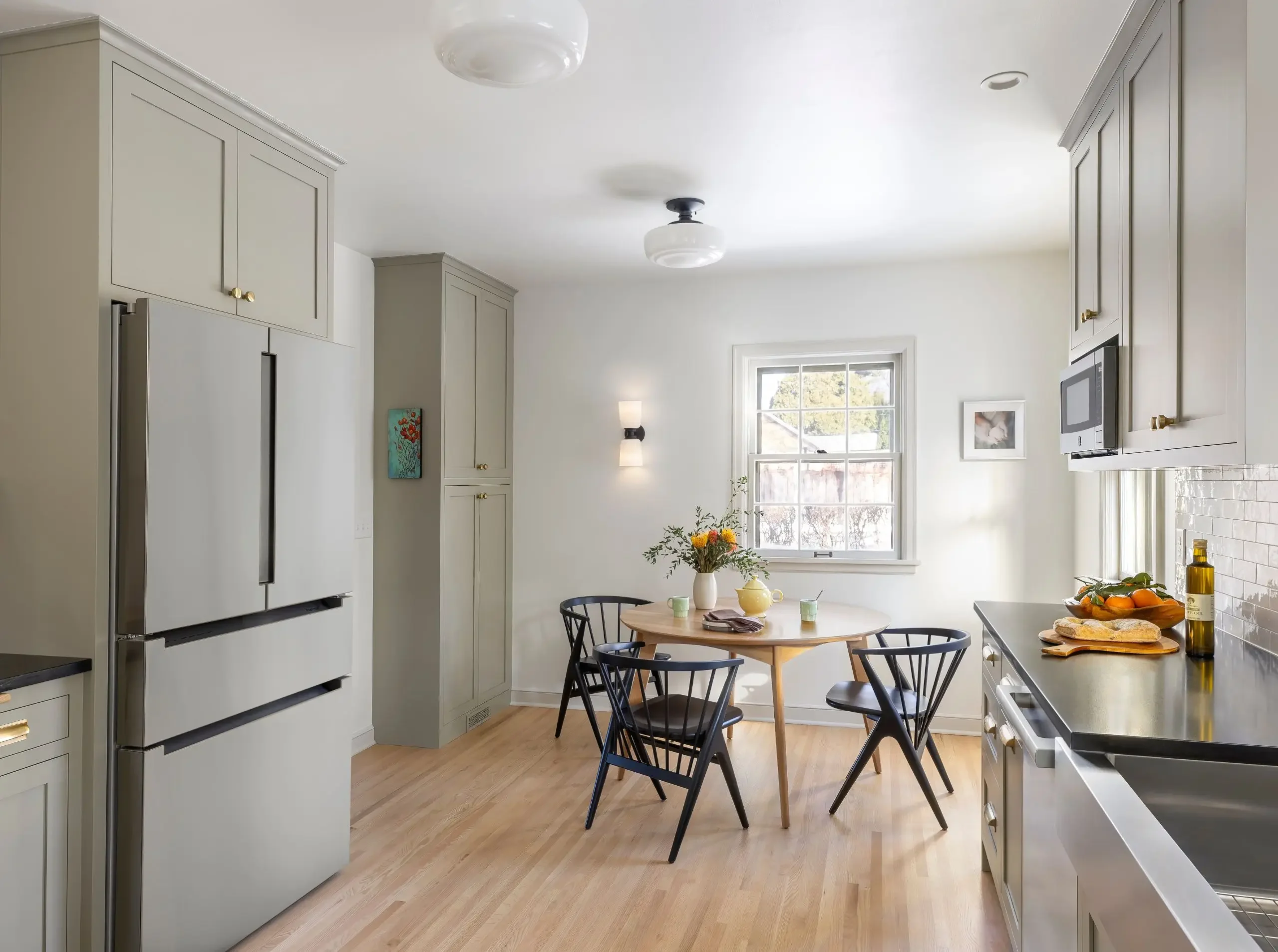 Kitchen remodel with continuous hardwood flooring in an older St. Paul home