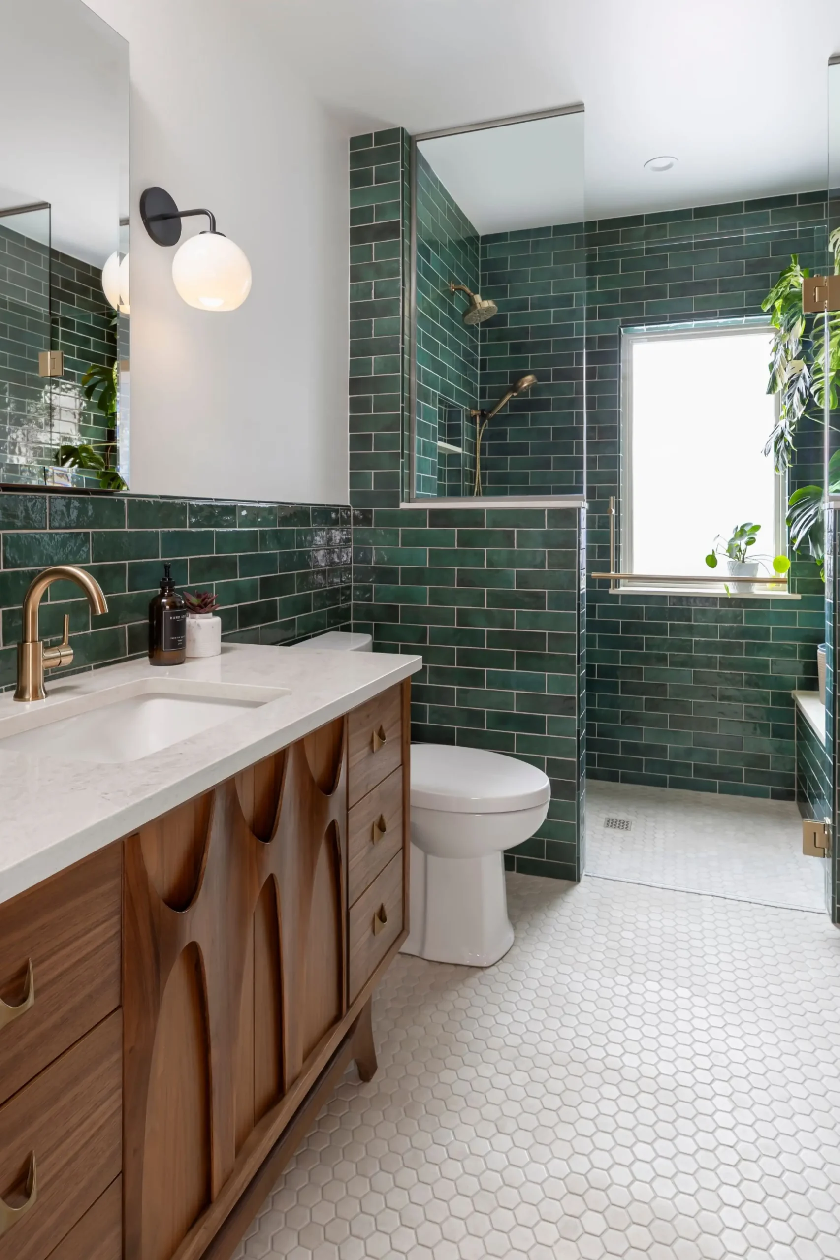 walk-in shower surrounded with a green rich subway tile