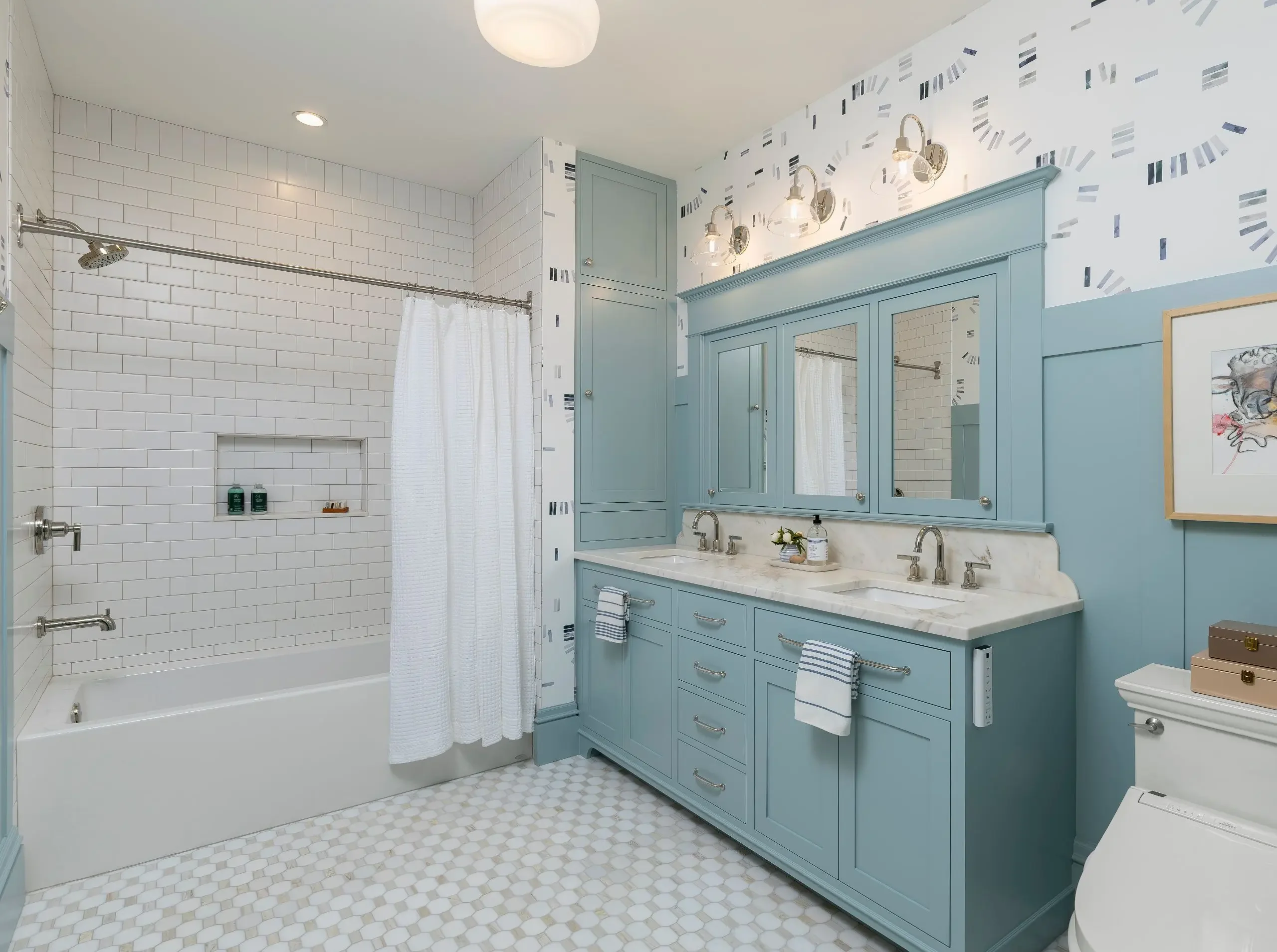 White subway tile surrounding an alcove bathtub