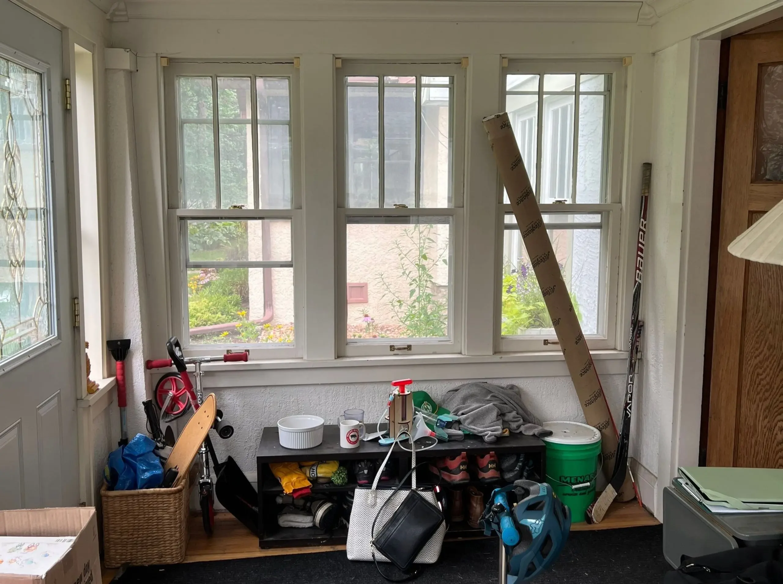 Bungalow porch entry before remodel with no dedicated coat or shoe storage